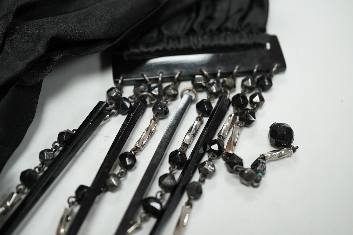 A quantity of assorted antique and later costume jewellery to include a silver and Marcasite ladies fob watch, a collection of cufflinks, brooches and a pair of drop earrings with screw backs